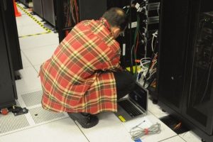 technician racking a server